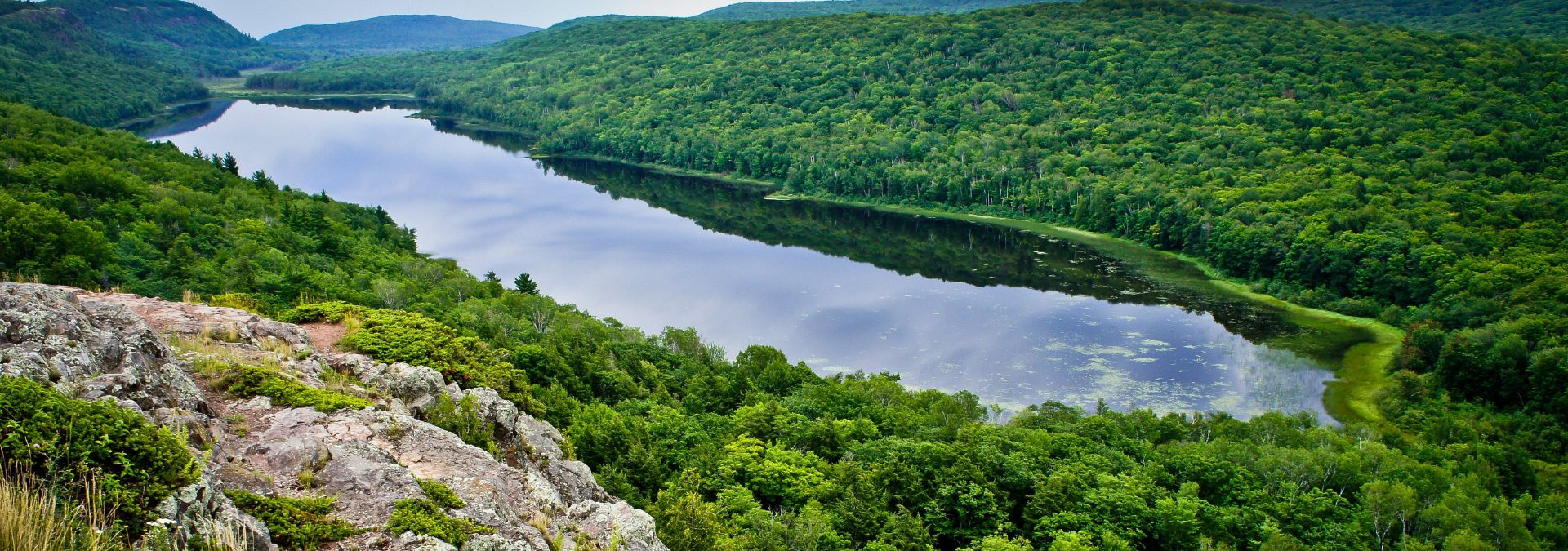 Lake of the Clouds from the escarpment with green Porcupine Mountains forest all around