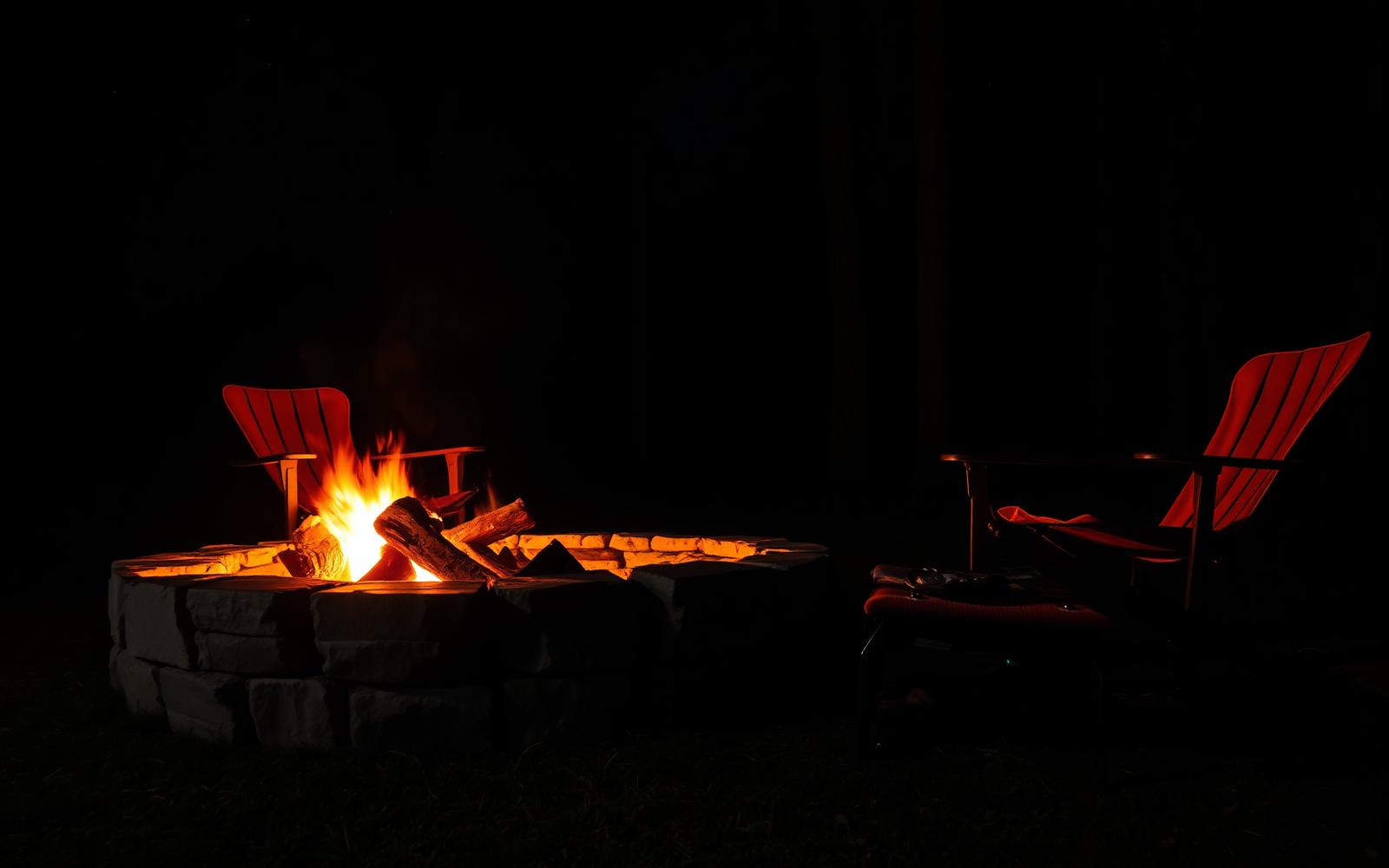 Fire pit at night with low embers